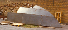 Frame structure of a steel steel yacht receiving its hull plating.