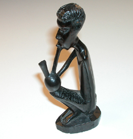 Kenyan wood carving - male figure smoking a pipe